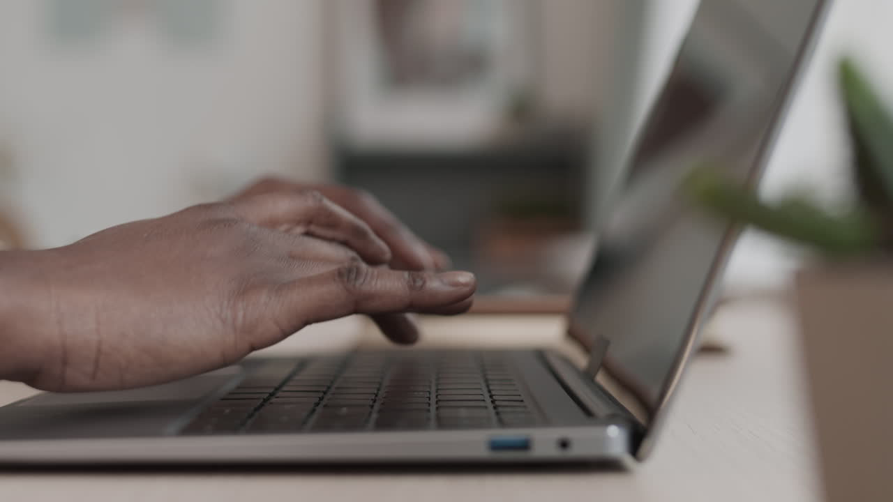 Female Hands Typing on Laptop Keyboard