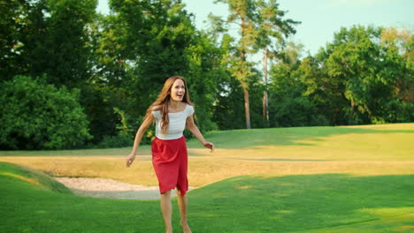 woman playing frisbee in green meadow. happy girl having fun in park