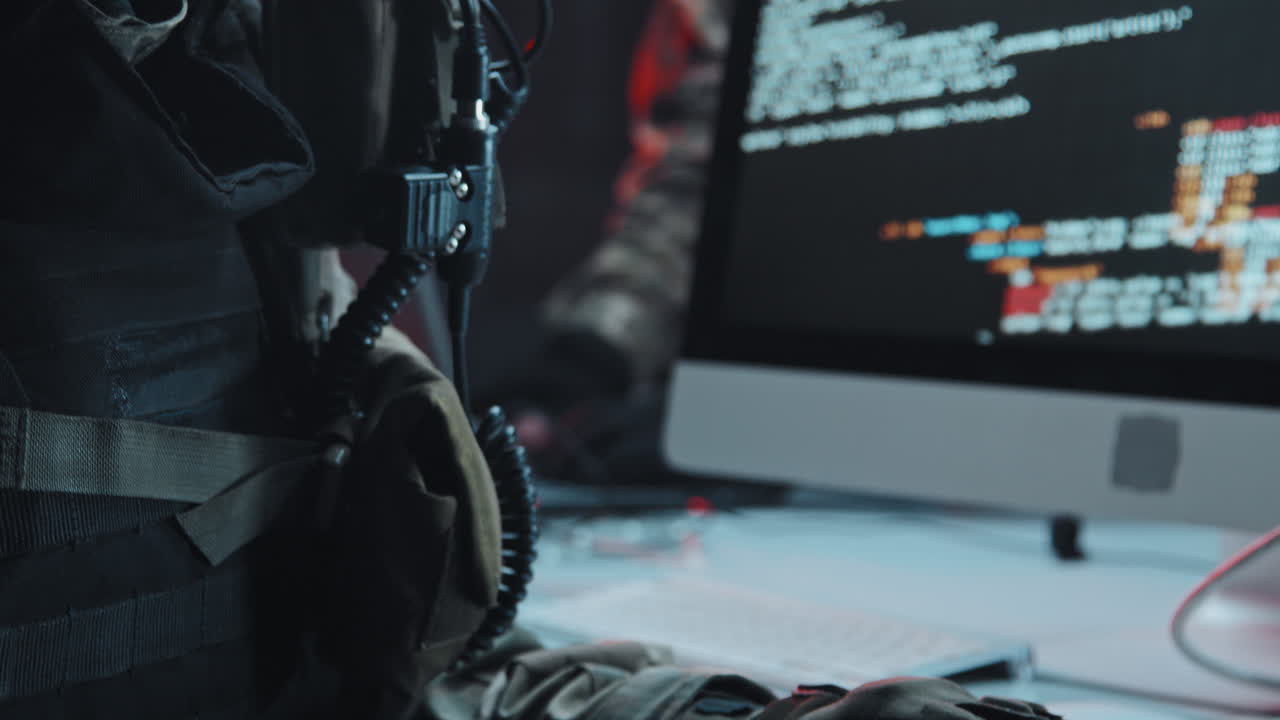 SWAT Officer Checking Hackers Computer