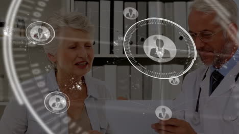 discussing medical information, doctor and elderly woman with digital animation overlay
