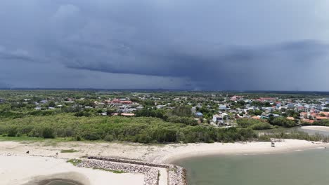 aerial view dolly of the embarkment at the sea and the stormy clouds in vung tau