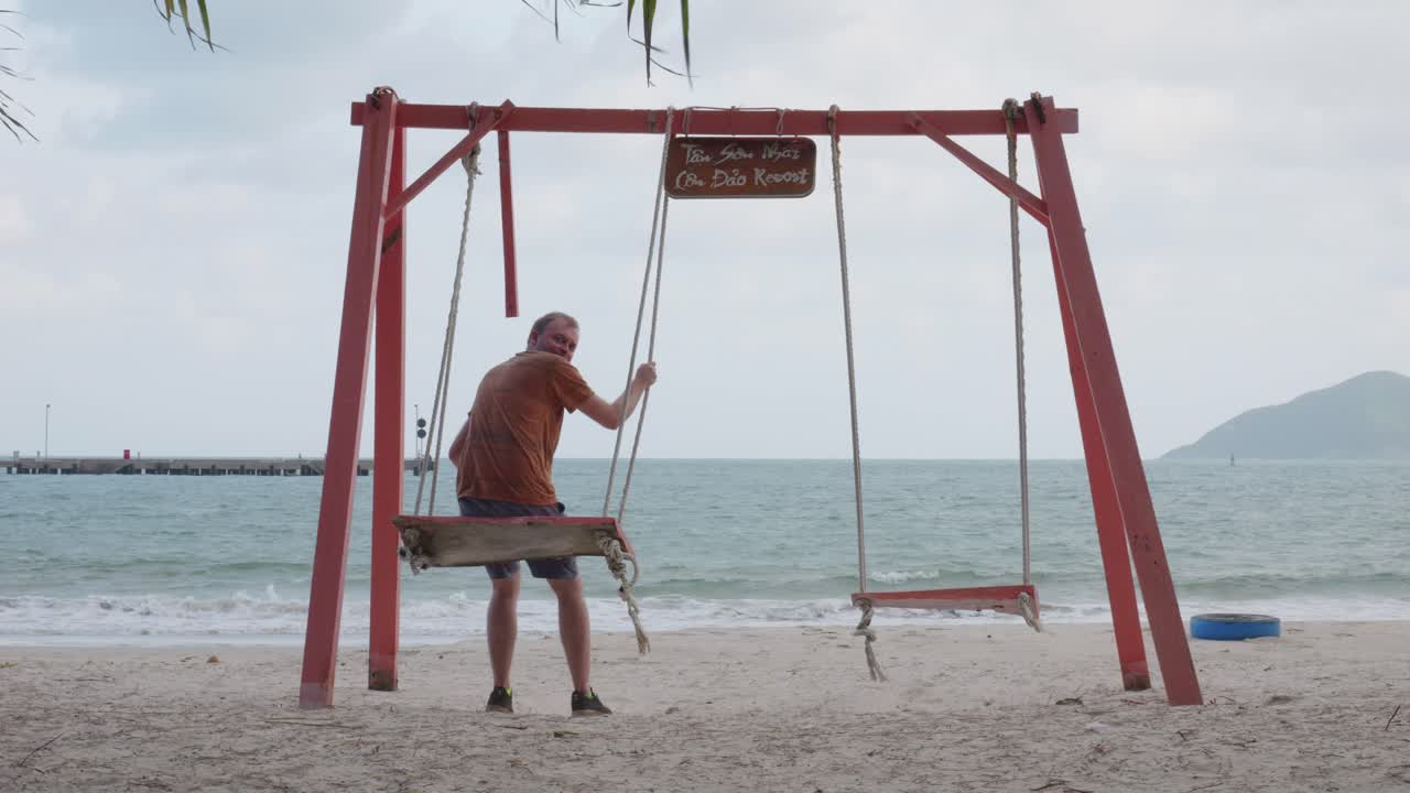 Man Swinging At The Beach, B&atilde;i tắm An Hải In Vietnam - wide
