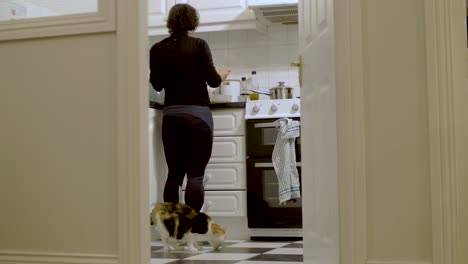 Young-woman-prepares-food-in-the-kitchen