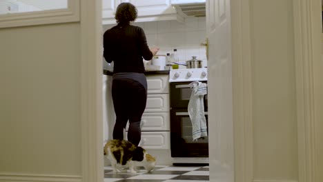 young woman prepares food in the kitchen