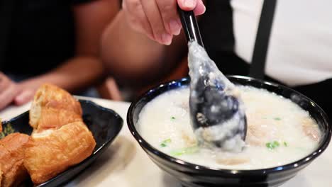 savoring traditional hong kong rice porridge dish