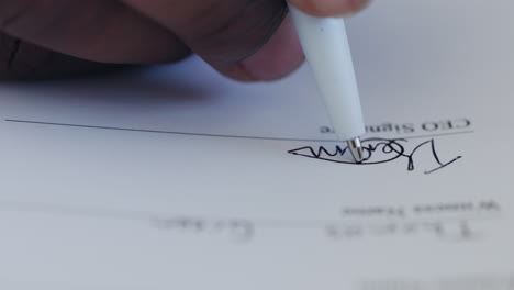 person signing a document