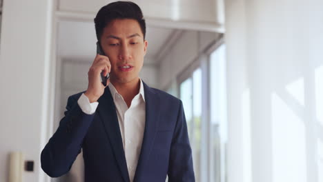 Phone-call,-business-and-asian-man-walking