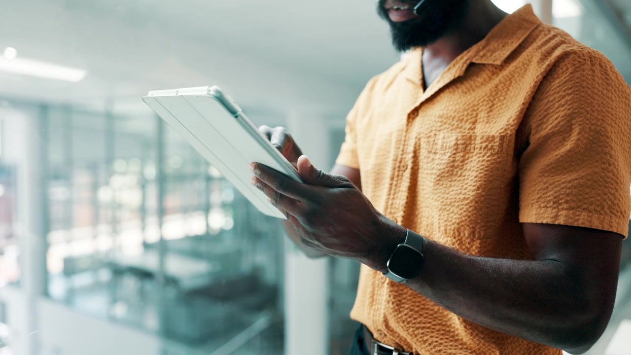 Man Using Digital Tablet in Modern Office Setting