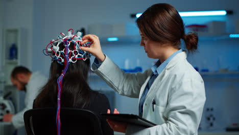 woman patient wearing performant eeg headset scanning brain