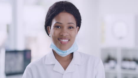 happy african female doctor smiling in her office
