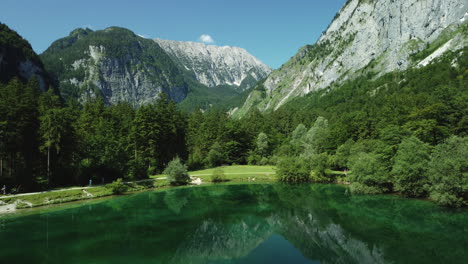 emerald lake nestled in the alps