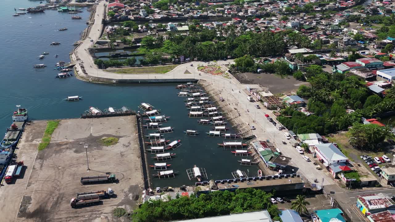 Tabaco Port With Outrigger Vessels In Summer In Albay, Bicol, Philippines. - aerial shot