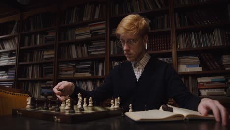 man playing chess in a library