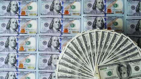 stacked and fan of us 100 dollar bills