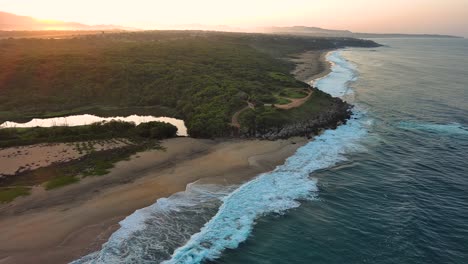 Drone-Aerial-View-Puerto-Escondido-Bacocho-Beach-Ocean-Shore-Jungle-Top-Sunrise