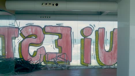 abandoned building with graffiti and ocean view