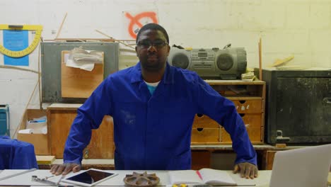 portrait of worker posing in foundry workshop 4k