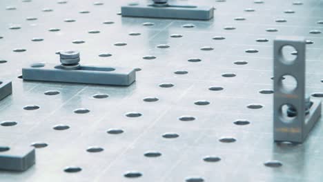 Surface-of-metal-installation-with-holes-and-plates.-Industrial-metal-surface