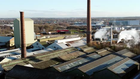 pilkington glass factory warehouse buildings aerial view descends to industrial town facility