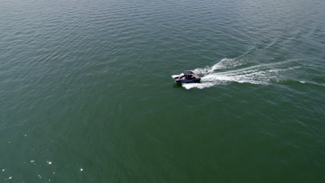 Person-practicing-water-skiing-on-the-lake