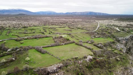 a wide overhead aerial of the stone arches of the ancient ruins of burnum, an archaeological site that used to be a roman legion camp and town near krka national park in dalmatia, croatia