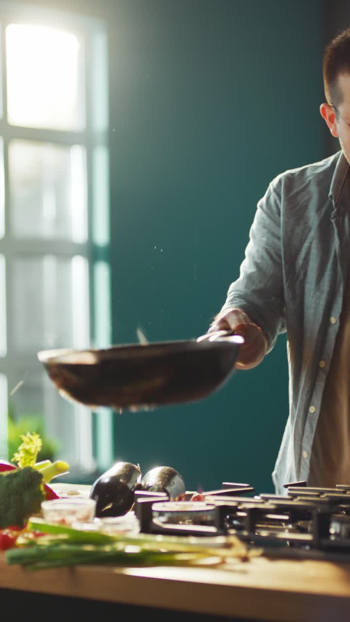 Man cooking stir-fry in kitchen