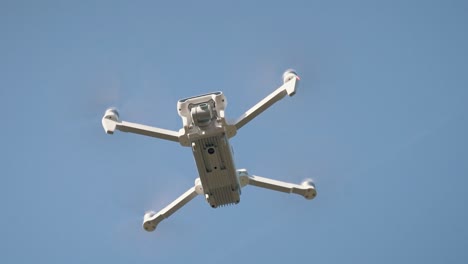 White-Drone-Flying-on-Nature-Background