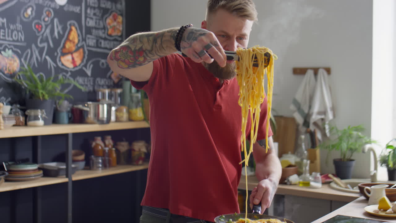 Food Blogger Putting Just Cooked Spaghetti on Plate