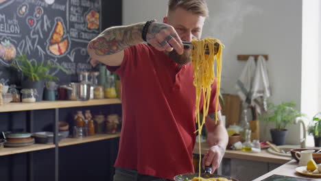 food blogger putting just cooked spaghetti on plate