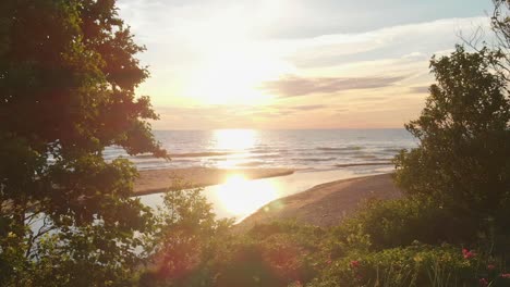 Reveal-golden-bright-sunset-of-Baltic-sea,-motion-view