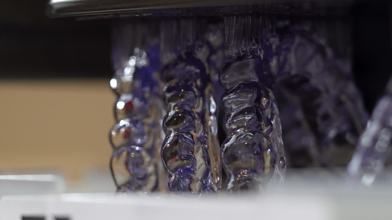 Close-up of freshly 3D printed dental retainers