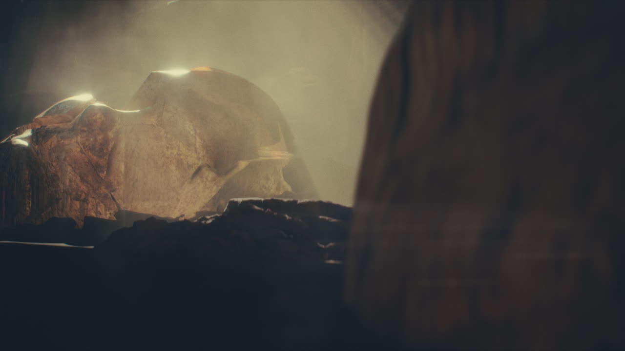 A head of the giant ancient deity statue hidden in a cave