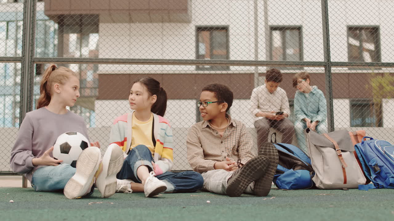 Diverse Children Playing with Ball in Schoolyard
