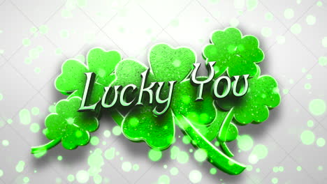 Animation-closeup-Lucky-You-text-and-motion-big-green-shamrocks-with-glitters-on-Saint-Patrick-Day-shiny-background-1