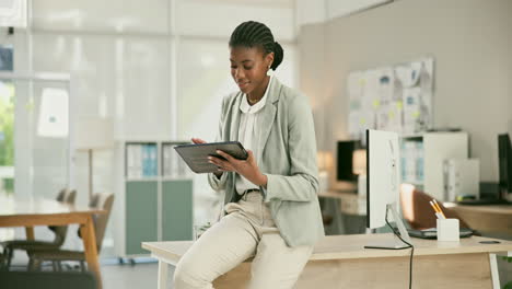 woman working on tablet in office