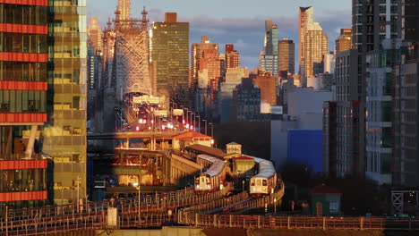 nyc subway at sunrise/sunset over the brooklyn bridge