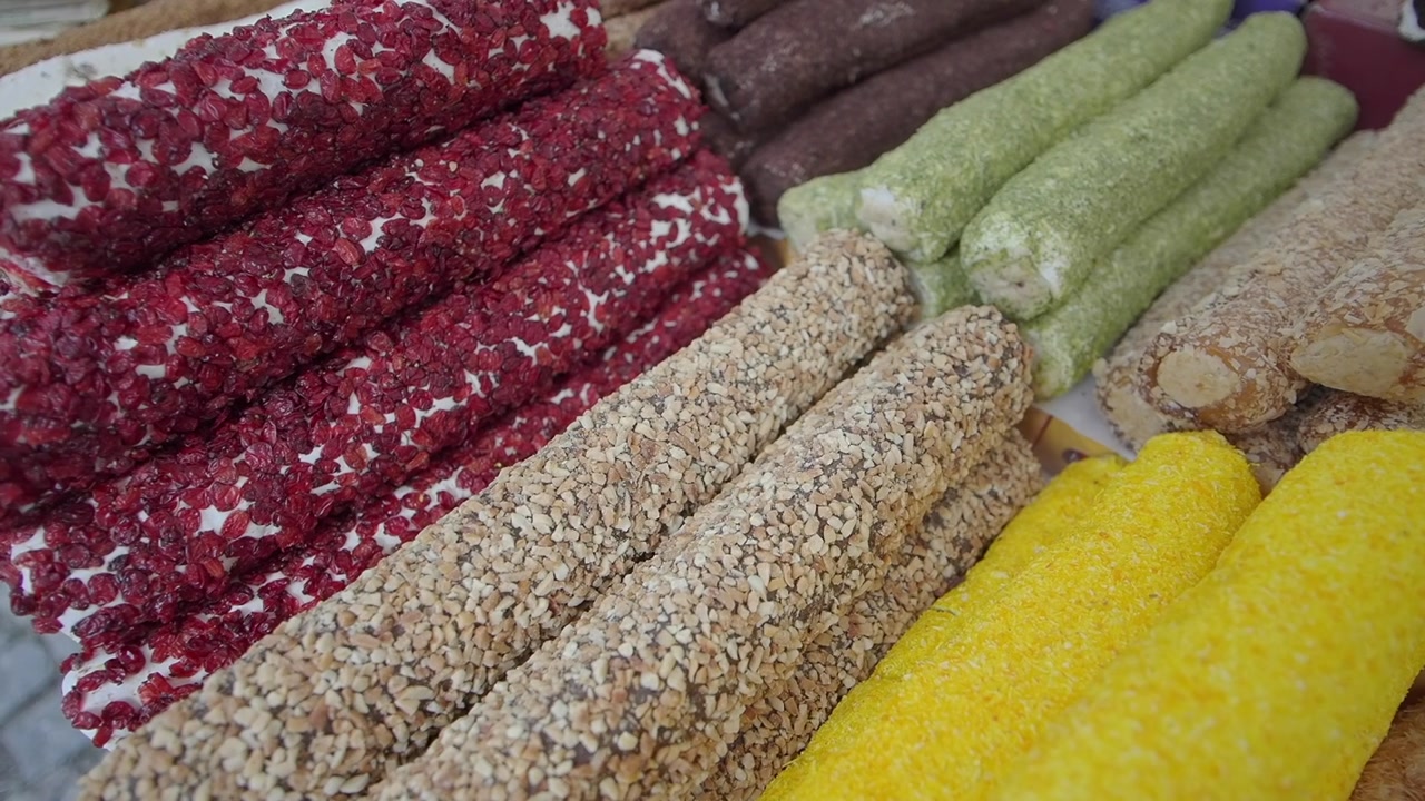 Assortment of Colorful Turkish Delight Rolls with Various Toppings