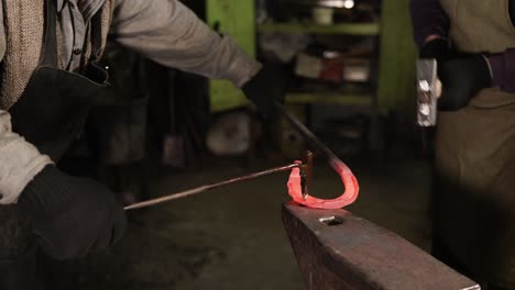 blacksmith working on a horseshoe