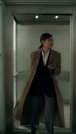 businesswoman in an elevator