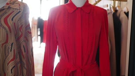 red pleated dress display