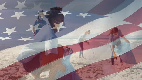 Composite-video-of-american-flag-against-group-of-diverse-female-volunteers-cleaning-the-beach