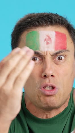 Man with mexican national flag upset with a referee
