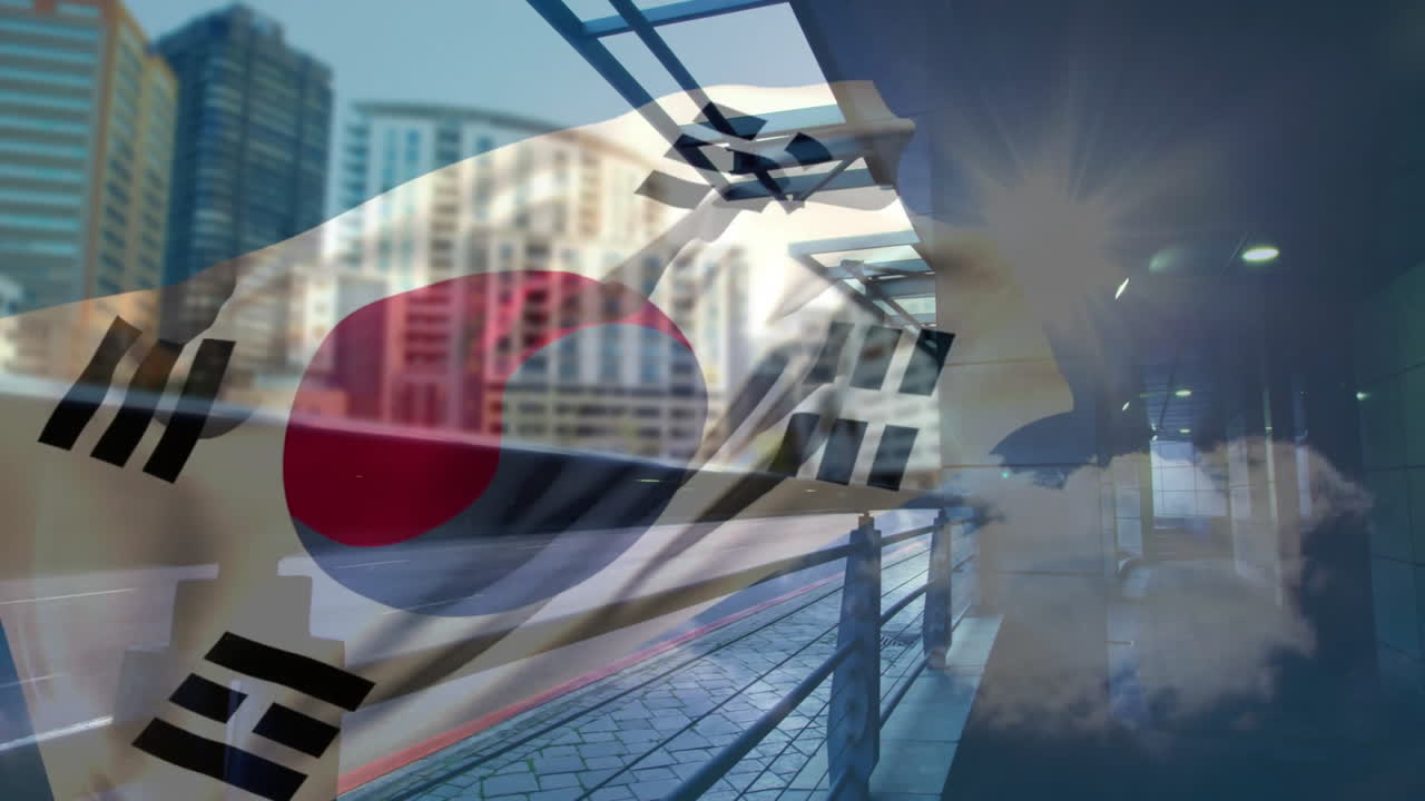 South Korean flag animation overlaying cityscape with modern buildings and sunlight