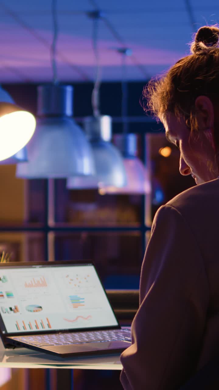Vertical video: Business manager checking research project overtime