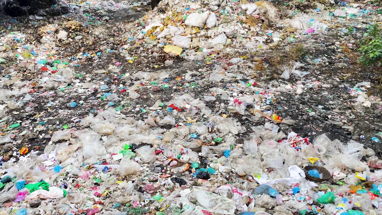 A dry canal choked with landfill and pollution in Dhaka, Bangladesh. Plastic pollution