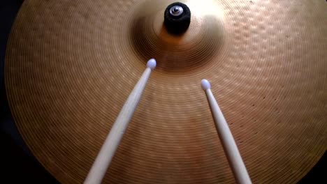 close up drummer playing on drum plate ride