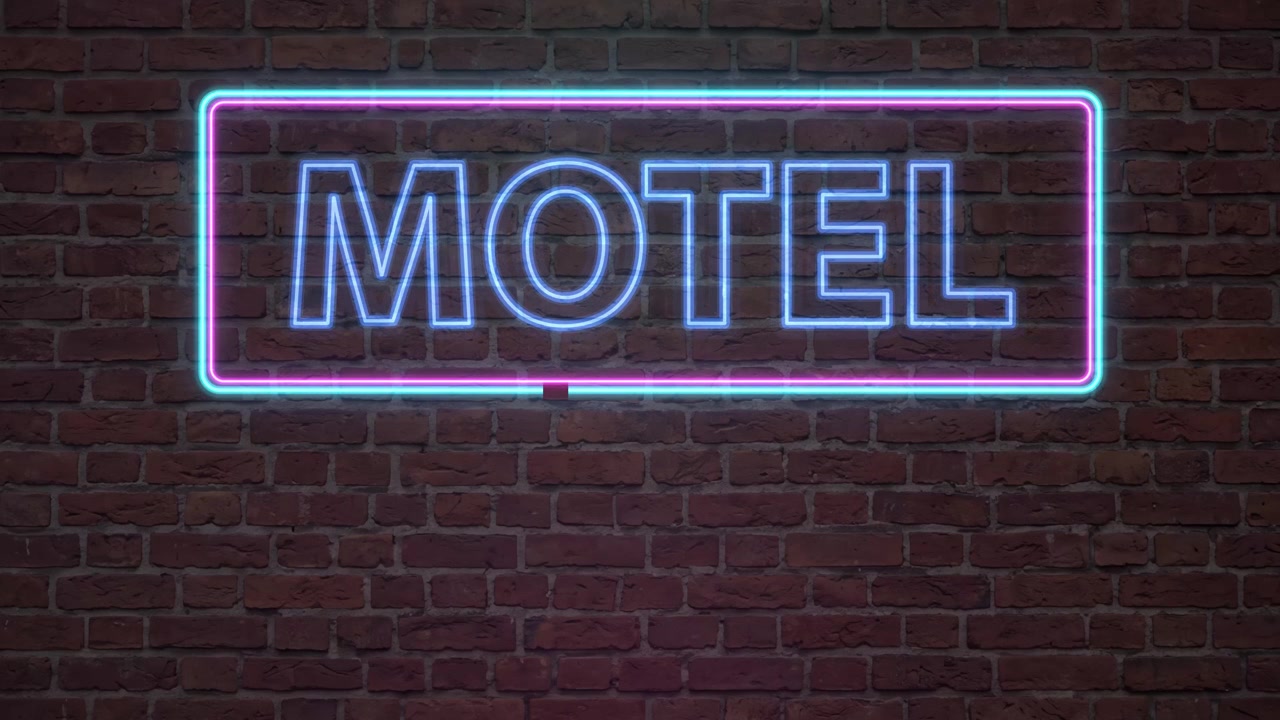 Enseigne de motel néon animée brillant de lumières bleues et violettes sur un fond de briques sombres.