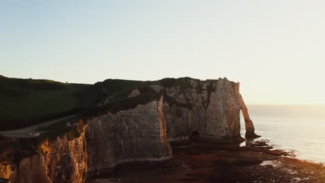 dramatic cliffs of étretat at sunset