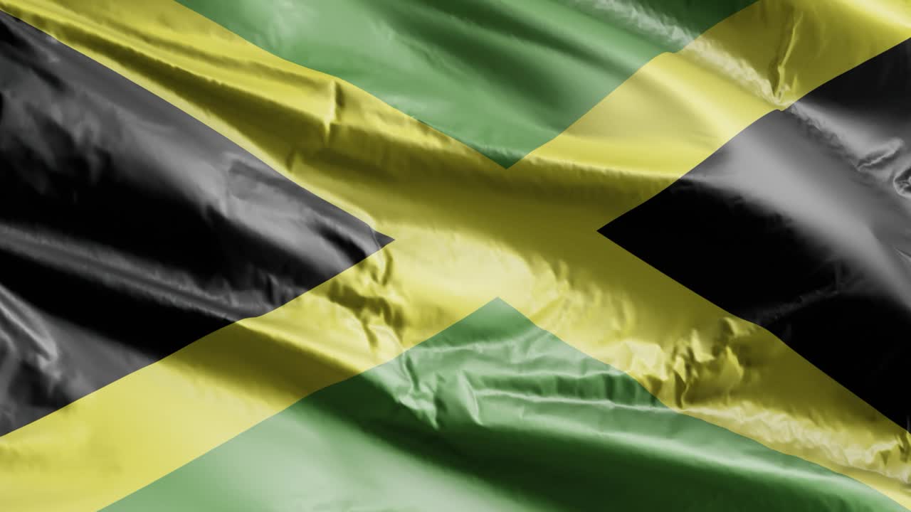 Jamaica flag slow waving on the wind loop. Jamaican banner smoothly swaying on the breeze. Full filling background. 20 seconds loop.