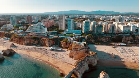 stunning aerial view of coastal city along the algarve in portugal